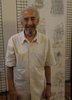L'artista Vito Tumiati davanti ad alcune sue opere (foto Ufficio Stampa del Comune)