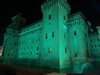 Castello estense illuminato di verde